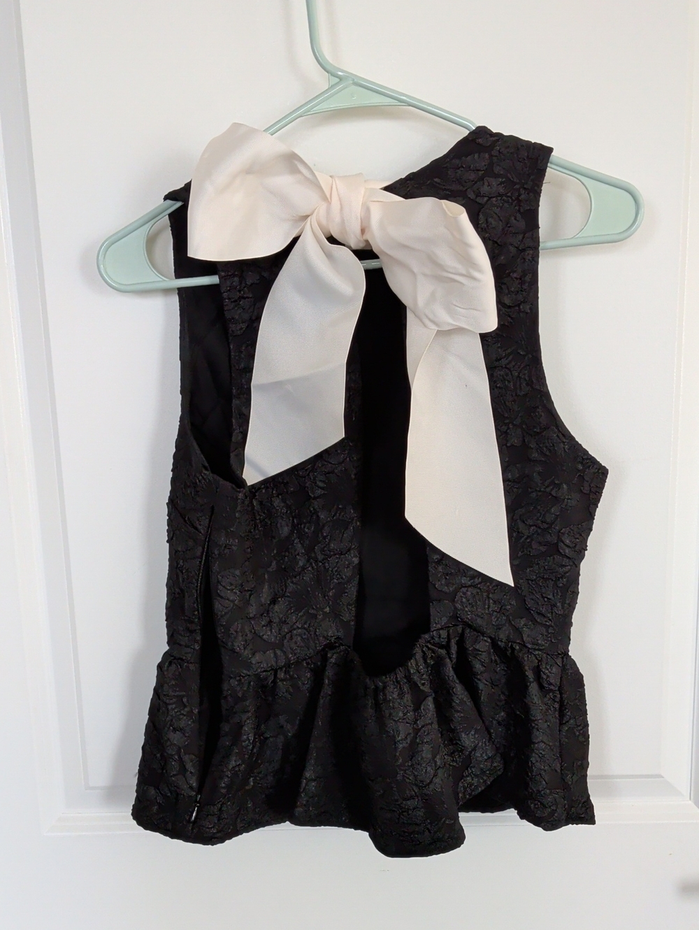 Girls Black Textured Peplum Top with Cream Bow